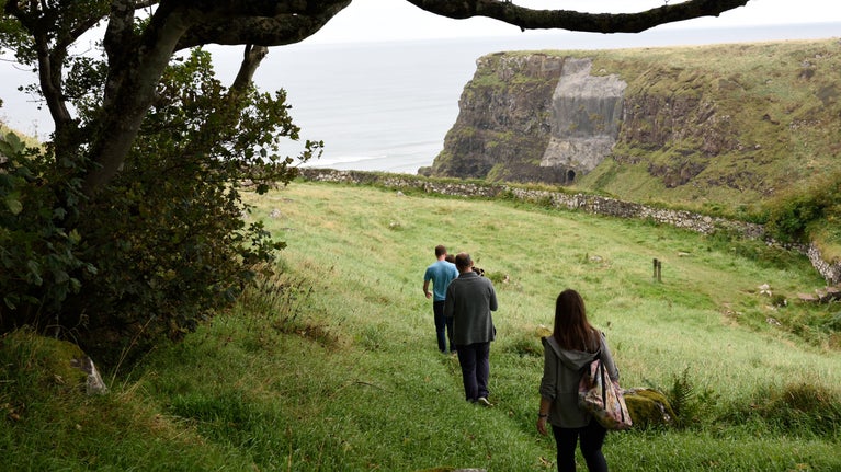 A photograph of a group walking through Downhill Demesne.